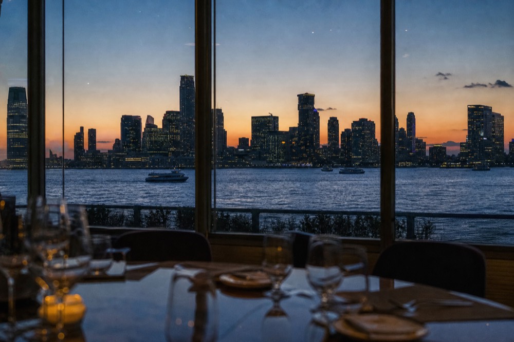 Manhattan skyline at the blue hour transition with window lights on and the last colour still in the sky above the towers